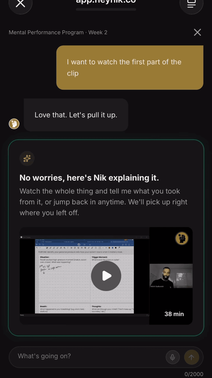 HeyNik app coaching chat, showing an inline video lesson from Nik pulled up mid-conversation.